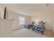 Charming bedroom features twin beds with floral bedding and an outside view at 141 Summer Place Loop, Clermont, FL 34714