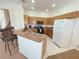 Modern kitchen includes ample counter space, great appliances, and a breakfast bar at 141 Summer Place Loop, Clermont, FL 34714