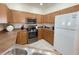 Well-appointed kitchen featuring stainless steel appliances, updated countertops, and ample cabinet space at 141 Summer Place Loop, Clermont, FL 34714
