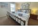 Comfortable main bedroom featuring a large bed with decorative pillows and bedside tables at 141 Summer Place Loop, Clermont, FL 34714