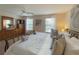Spacious main bedroom with natural light, dresser, and a view from the bed at 141 Summer Place Loop, Clermont, FL 34714