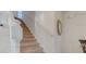 Carpeted staircase with white handrail leading to the upper level of the home at 141 Summer Place Loop, Clermont, FL 34714