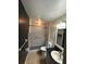 Bathroom with a shower and a granite-top vanity featuring modern fixtures at 1512 Ison Ln, Ocoee, FL 34761