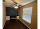 Bright bedroom with a ceiling fan, built-in desk, and large window at 1512 Ison Ln, Ocoee, FL 34761