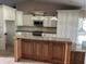 Modern kitchen with a granite island, stainless steel appliances, and ample cabinetry at 1512 Ison Ln, Ocoee, FL 34761
