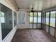 Enclosed sunroom with brick flooring and multiple windows for ample natural light at 1512 Ison Ln, Ocoee, FL 34761