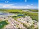 An expansive community with a lush green space, a lake with fountain, and plentiful single Gathering homes and townhouses at 2804 Club Cortile Cir # A, Kissimmee, FL 34746