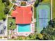 Aerial view of community amenities including a clubhouse, pool, playground, and tennis court at 2804 Club Cortile Cir # A, Kissimmee, FL 34746