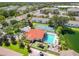 Overhead view of community pool, playground, tennis court and clubhouse amenities for residents of this community at 2804 Club Cortile Cir # A, Kissimmee, FL 34746