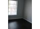 Bedroom with wood floors and window at 2804 Club Cortile Cir # A, Kissimmee, FL 34746