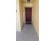 View of a front door with visible unit number on a tan stucco wall creating a welcoming entrance to the property at 2804 Club Cortile Cir # A, Kissimmee, FL 34746