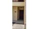 Exterior front door with visible unit number on a tan stucco wall, adding curb appeal to this charming property at 2804 Club Cortile Cir # A, Kissimmee, FL 34746