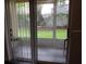 View of patio with sliding glass doors at 2804 Club Cortile Cir # A, Kissimmee, FL 34746