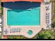 An aerial view of a large community pool and jacuzzi with plenty of seating at 2804 Club Cortile Cir # A, Kissimmee, FL 34746