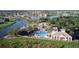 Aerial view of community pool, clubhouse, and lake. Resort style living at it's finest! at 3600 Harbor Isles Ct, Kissimmee, FL 34746