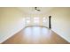 Light and airy empty room featuring three large windows that offer plenty of natural light and stunning view at 3600 Harbor Isles Ct, Kissimmee, FL 34746