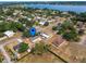 Aerial view of the property in a neighborhood with access to a nearby lake at 629 N 7Th St, Lake Wales, FL 33853