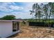 Spacious backyard featuring mature trees and partial fencing at 629 N 7Th St, Lake Wales, FL 33853