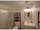Bathroom featuring a glass-enclosed shower, vanity with a mirror, and decorative storage shelves at 629 N 7Th St, Lake Wales, FL 33853