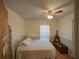 A cozy bedroom with a ceiling fan and bright natural light at 629 N 7Th St, Lake Wales, FL 33853