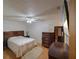 Bedroom with ceiling fan, wood-look floors, and neutral wall color at 629 N 7Th St, Lake Wales, FL 33853