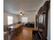 A spacious dining room with a ceiling fan and vintage hutch at 629 N 7Th St, Lake Wales, FL 33853