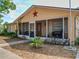 Charming single-story home featuring a screened porch, stucco facade, and simple landscaping at 629 N 7Th St, Lake Wales, FL 33853
