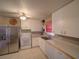 Functional kitchen with white cabinetry, a stainless steel refrigerator, and modern appliances at 629 N 7Th St, Lake Wales, FL 33853