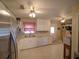 Bright kitchen features white cabinets, stainless steel refrigerator and an adjacent dining space at 629 N 7Th St, Lake Wales, FL 33853
