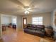 Open living area with wood-look flooring, ceiling fan and exterior door at 629 N 7Th St, Lake Wales, FL 33853