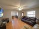 Spacious living room featuring wood-look floors, neutral wall color, and great natural light at 629 N 7Th St, Lake Wales, FL 33853