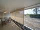 Outdoor patio with retractable shades overlooking a spacious backyard, perfect for relaxation and privacy at 629 N 7Th St, Lake Wales, FL 33853