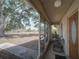 Spacious screened-in porch with comfortable chairs and a relaxing view of the front lawn at 629 N 7Th St, Lake Wales, FL 33853