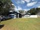 Charming single-story home featuring well-maintained landscaping and an attached garage at 6922 Doehring Dr, Lakeland, FL 33810