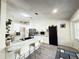 Modern kitchen featuring white cabinets, stainless steel appliances, and tiled floors at 6922 Doehring Dr, Lakeland, FL 33810