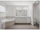 Bright bathroom features a double sink vanity, modern fixtures, and a separate toilet room at 8352 Lookout Pointe Dr, Windermere, FL 34786
