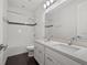 Bathroom featuring double sinks, tiled shower, and modern fixtures at 8352 Lookout Pointe Dr, Windermere, FL 34786