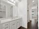 Clean bathroom with white cabinets, quartz countertop, and modern fixtures at 8352 Lookout Pointe Dr, Windermere, FL 34786