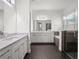 Contemporary bathroom with dual vanities, a tub, and a walk-in shower at 8352 Lookout Pointe Dr, Windermere, FL 34786