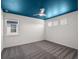 Cozy bedroom features a tray ceiling painted blue with a ceiling fan and natural light at 8352 Lookout Pointe Dr, Windermere, FL 34786