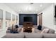 Cozy living room featuring sofas, a wooden coffee table and a barn door at 8352 Lookout Pointe Dr, Windermere, FL 34786