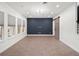 Open-concept living area with recessed lighting, multiple windows, and a barn door at 8352 Lookout Pointe Dr, Windermere, FL 34786