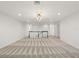 Large upstairs loft with neutral carpet, recessed lighting and view of the landing at 8352 Lookout Pointe Dr, Windermere, FL 34786
