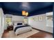 Relaxing bedroom with natural light, stylish light fixture, and elegant decor at 8352 Lookout Pointe Dr, Windermere, FL 34786