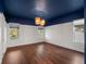 Comfortable bedroom featuring a unique dark blue ceiling and modern light fixture at 8352 Lookout Pointe Dr, Windermere, FL 34786
