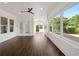 Spacious sunroom with many windows allowing natural light and views of the backyard at 8352 Lookout Pointe Dr, Windermere, FL 34786