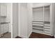 Organized closet featuring shelves, drawers and a clothing rod for storage and organization at 8352 Lookout Pointe Dr, Windermere, FL 34786