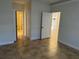 Bedroom with tile flooring showing the bathroom across the hall at 2550 Bella Vista Dr, Davenport, FL 33897
