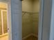 Walk-in closet with wire shelving and access to the bathroom at 2550 Bella Vista Dr, Davenport, FL 33897