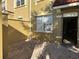 Private courtyard entrance featuring a brick paver patio and stucco privacy wall at 2550 Bella Vista Dr, Davenport, FL 33897